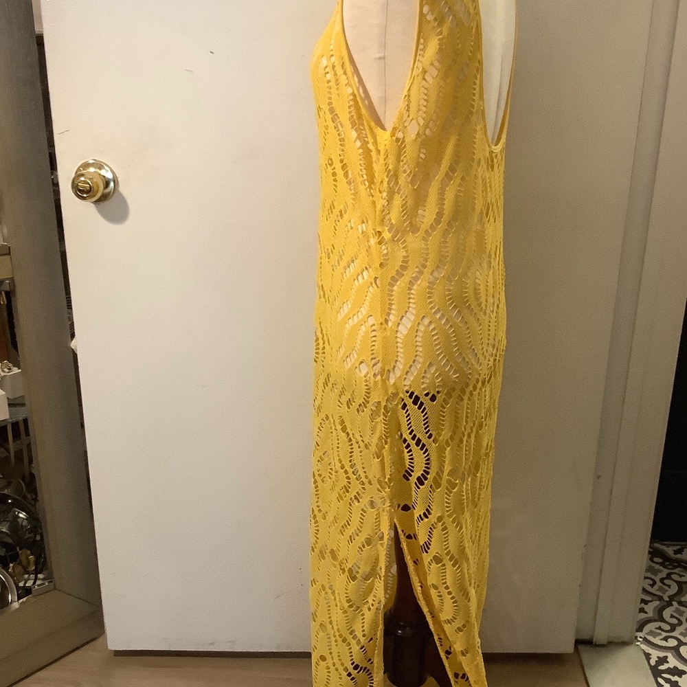St Tropez yellow crochet maxi side slit dress.